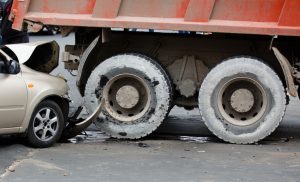 Passenger car crashed into a truck.